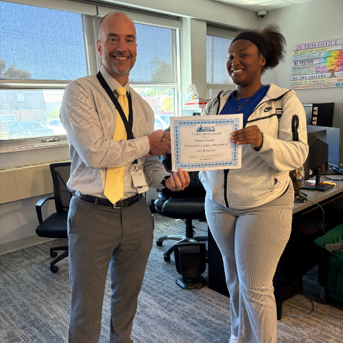 Ziyonna Overton, Erie High's Stairclimber for October, poses with his award plaque.